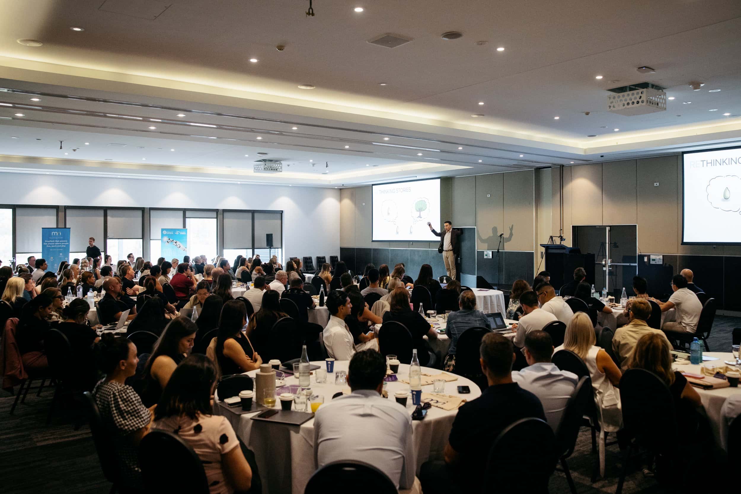 Wide view of a Sydney conference audience during a keynote
