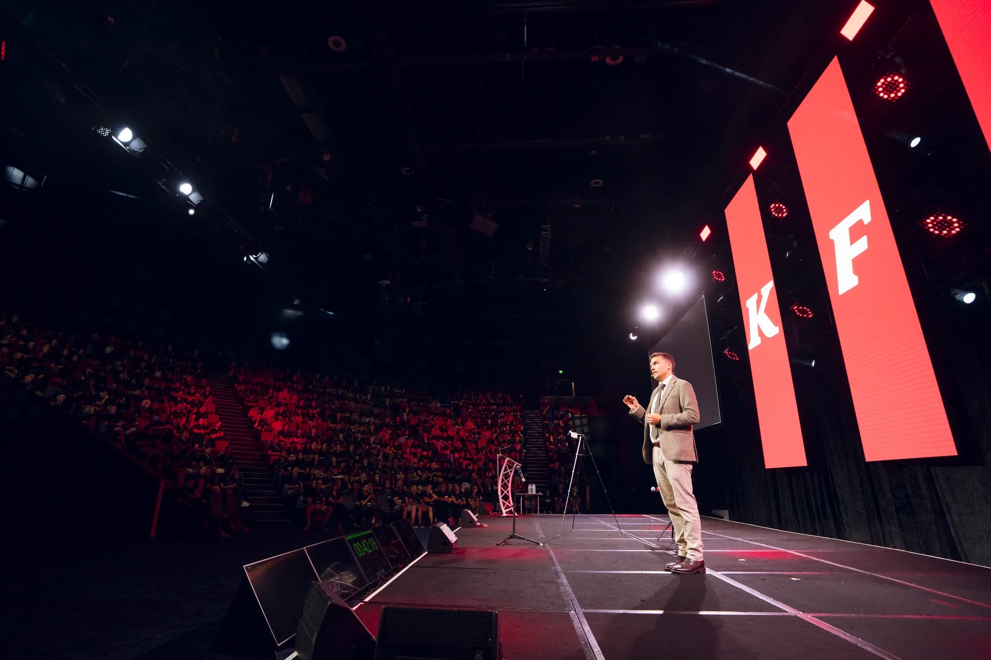 Andy Nunn presenting to a large corporate conference audience