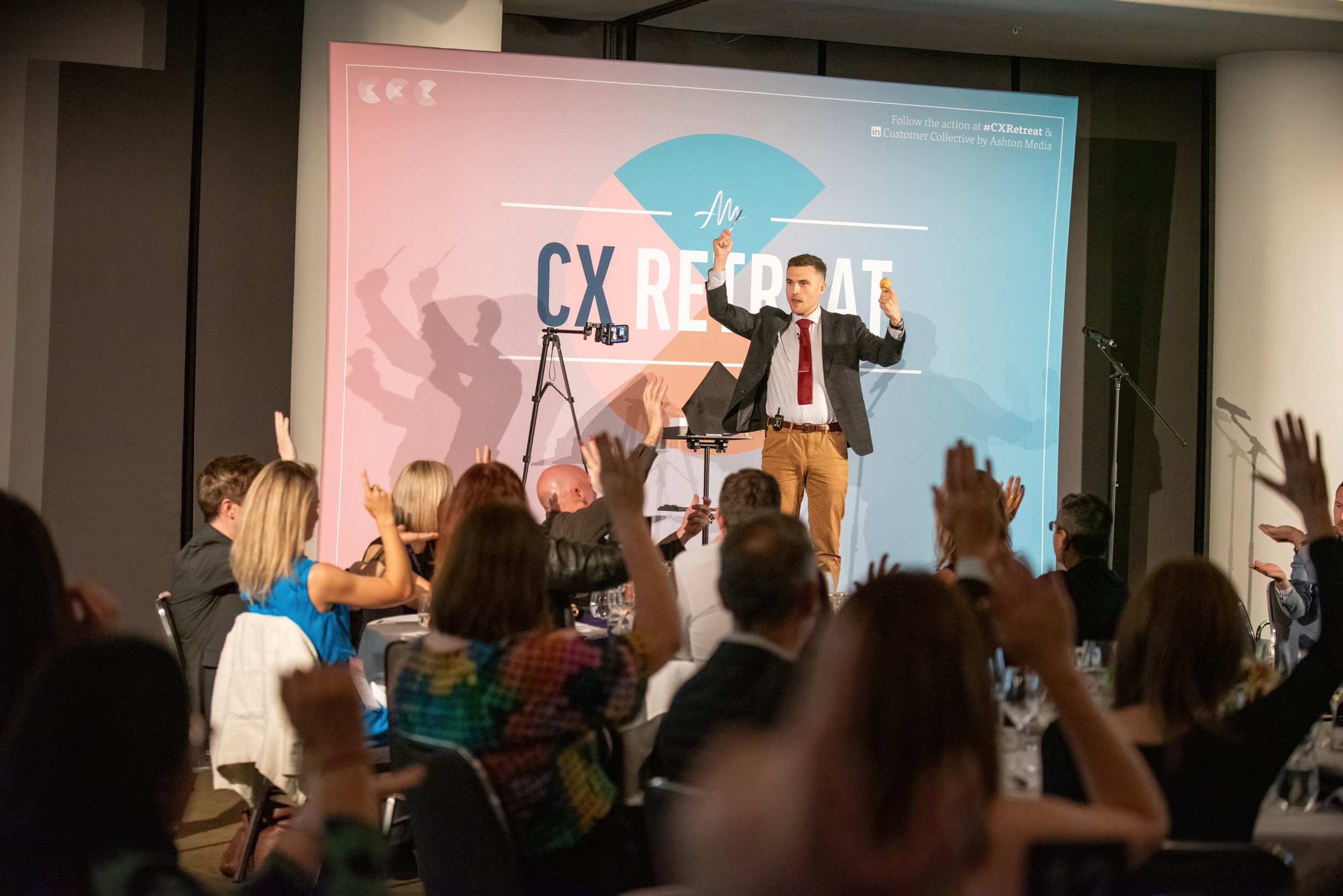 Andy Nunn addressing attendees at a CX Retreat event