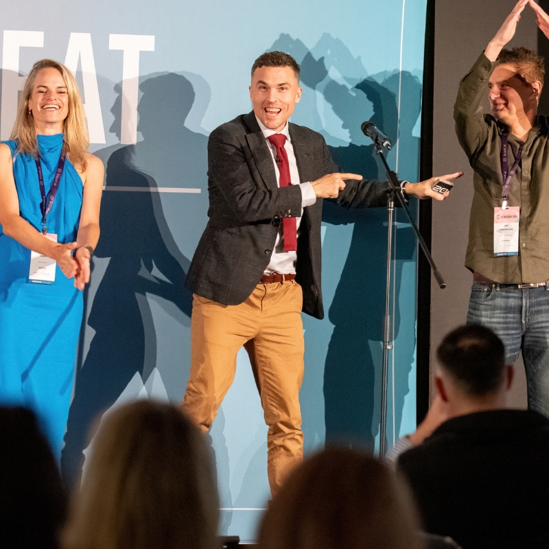 Andy Nunn performing with audience volunteers at a corporate event