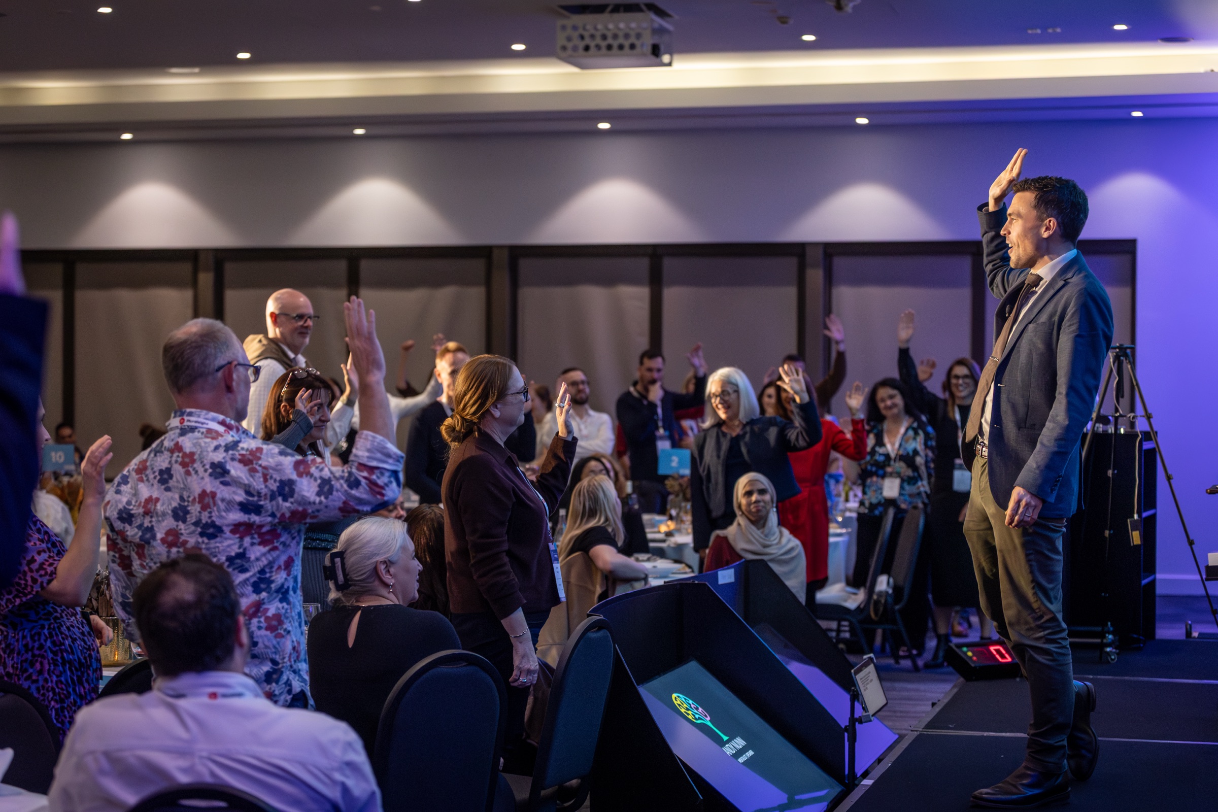Andy Nunn performing for an audience at the L&D Symposium
