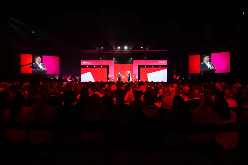 A full theatre watching Andy Nunn present on stage