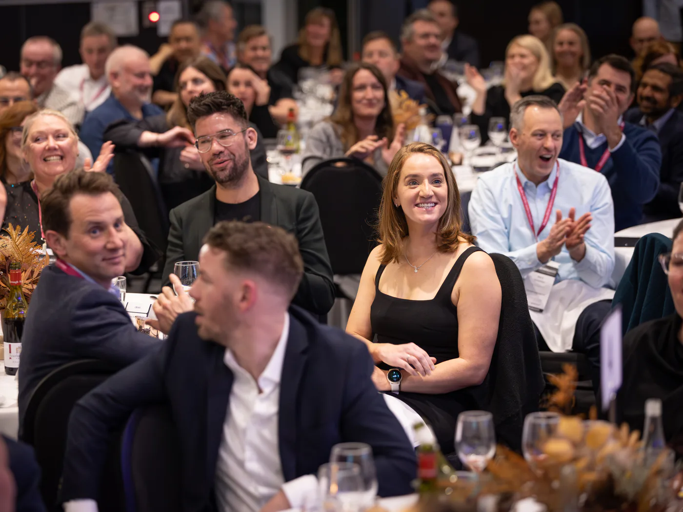 Sydney audience members smiling and applauding during Andy Nunn's keynote