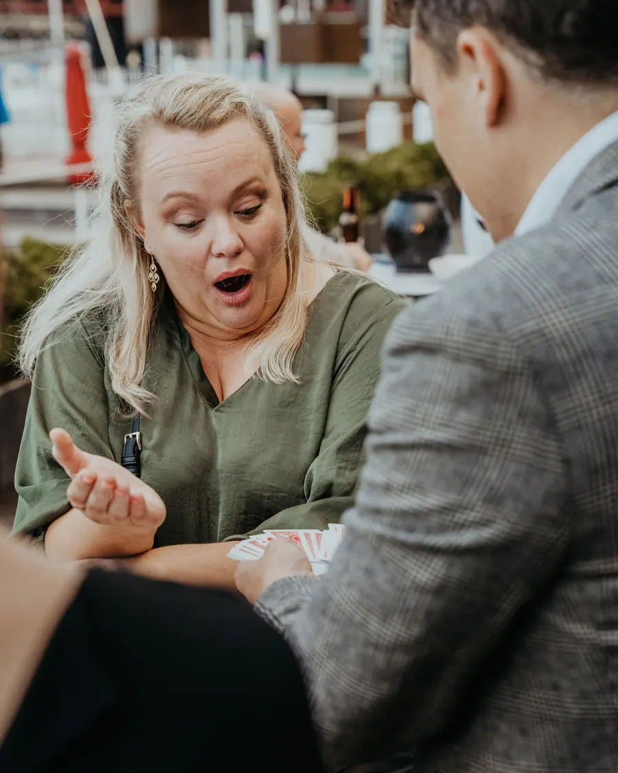 A corporate guest reacting with surprise during Andy Nunn's close-up entertainment
