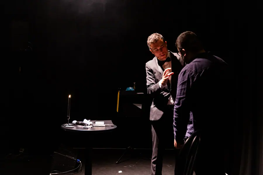 Andy Nunn performing a stage mentalism routine with a corporate event volunteer