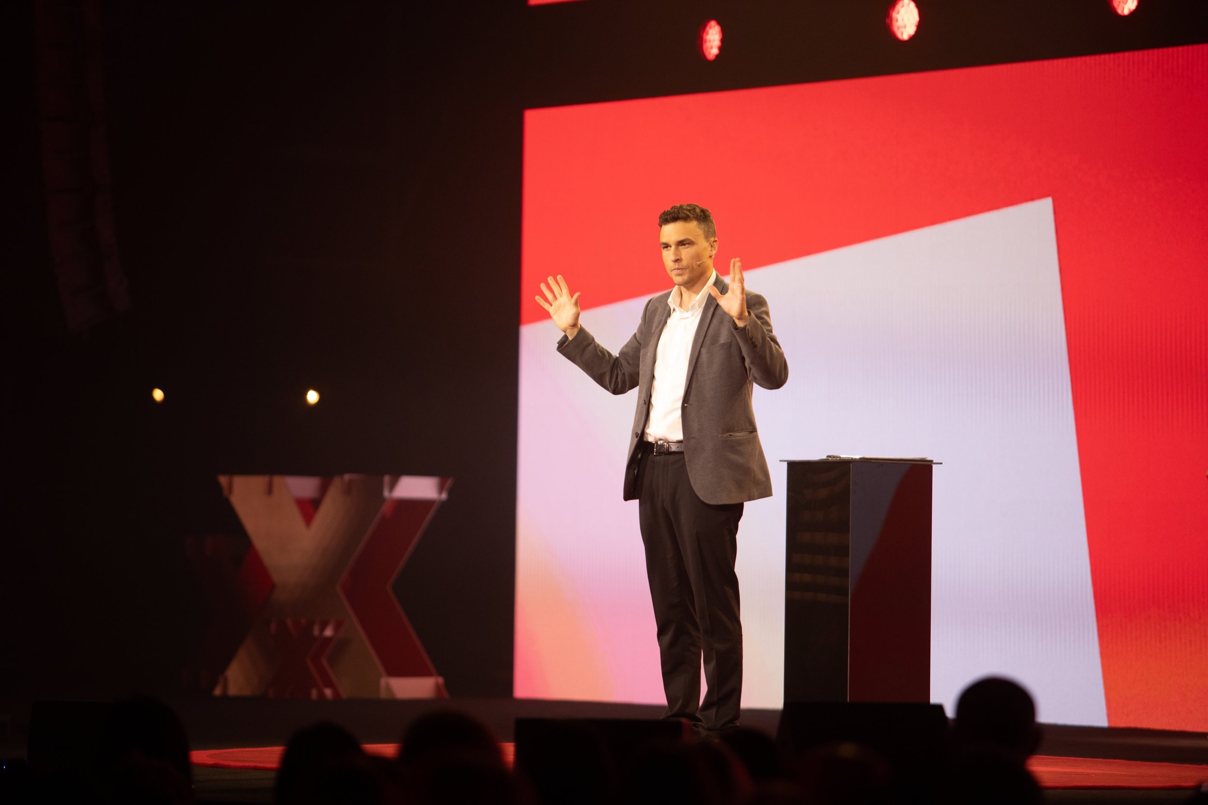 Andy Nunn presenting on stage as a keynote speaker in Melbourne