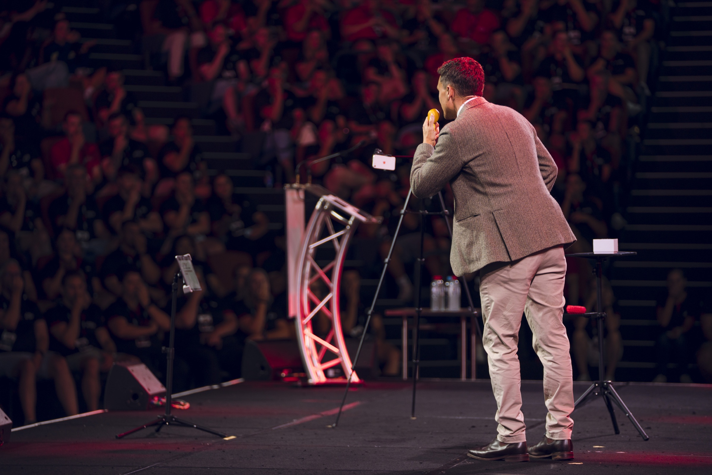 Andy Nunn speaking to a large conference audience in Melbourne