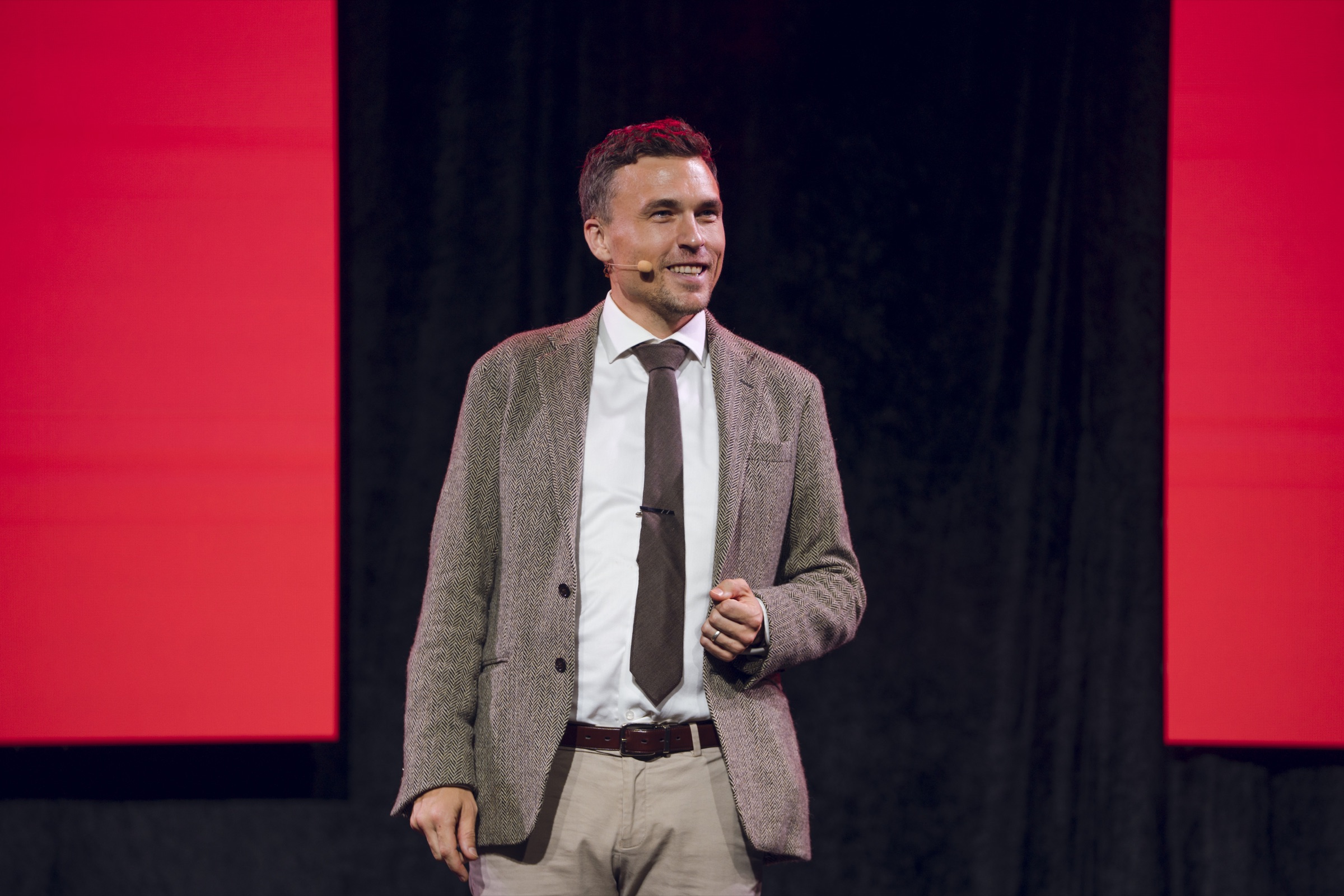 Andy Nunn delivering an interactive keynote on stage in Melbourne