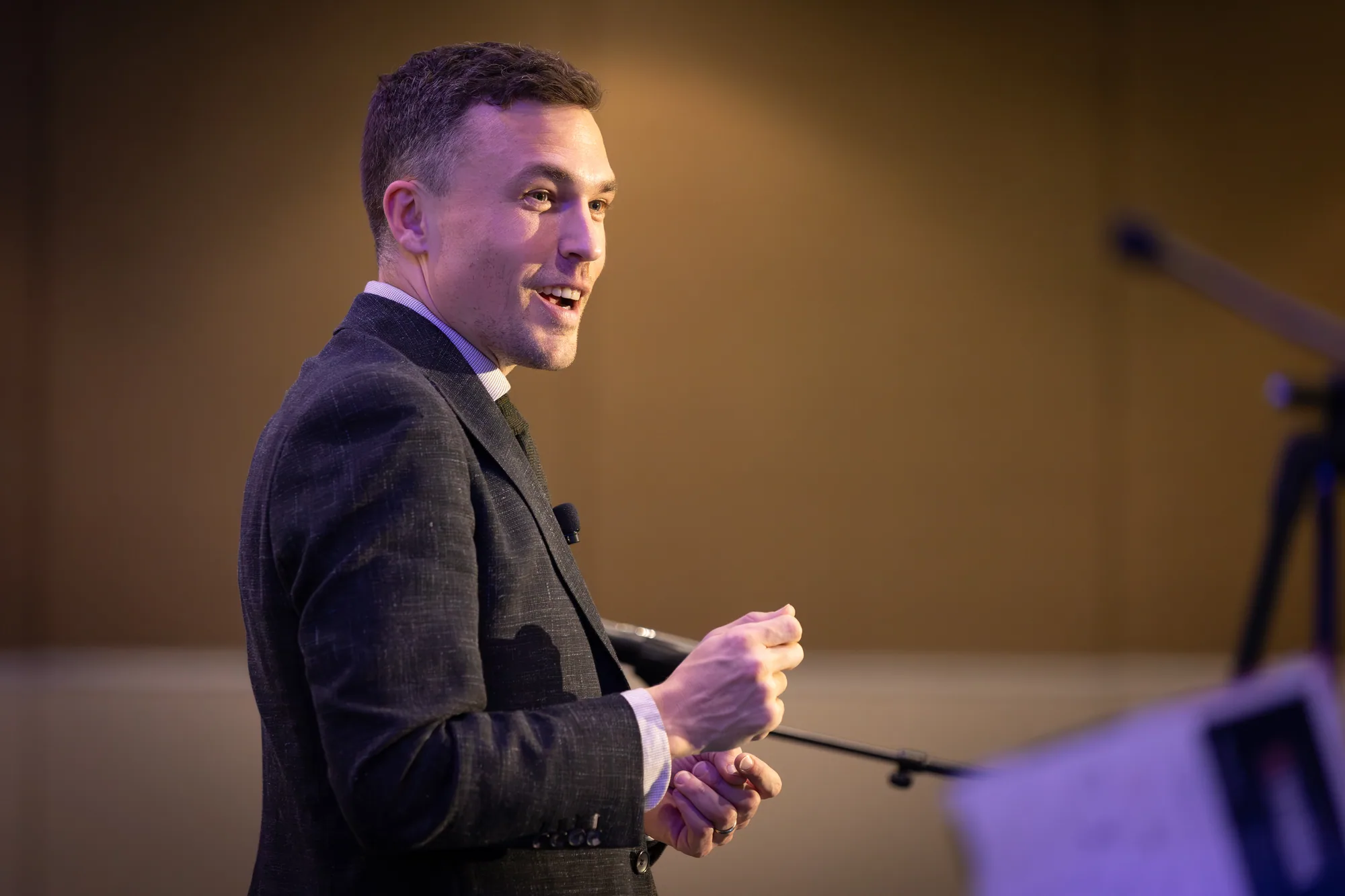 Andy Nunn smiling during an interactive conference presentation
